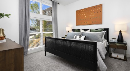 Bedroom with natural lighting and high ceilings