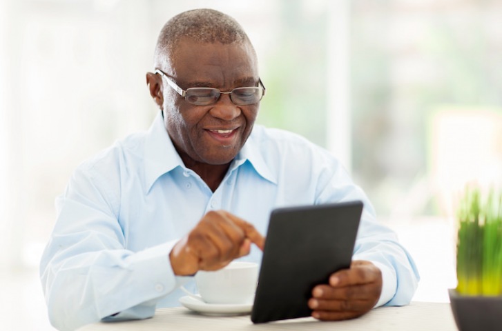 Older Man using technology, Ipad