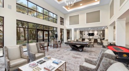 a spacious club and lounge with billiards