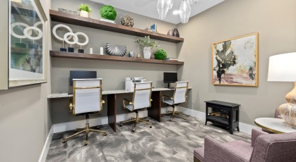 a computer lounge with computers and a printer