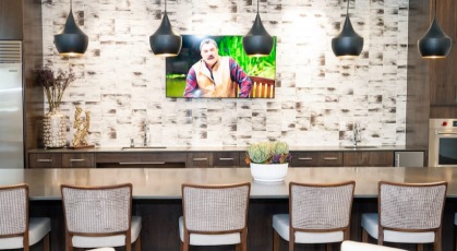 view of the bar and TV located in the spacious residents lounge