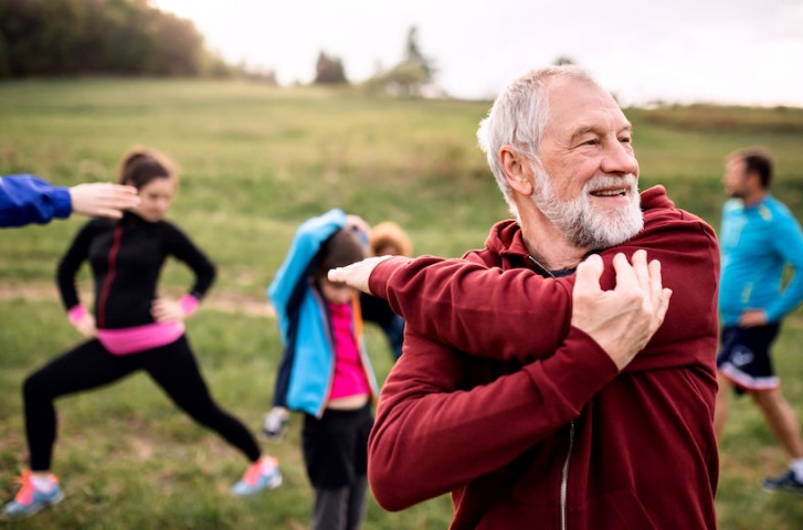 man stretching staying active