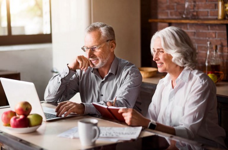 two old people working on a computer