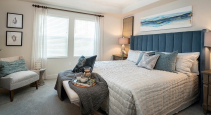 large windows brighten spacious bedroom