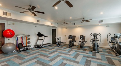 ceiling fans throughout bright fitness center