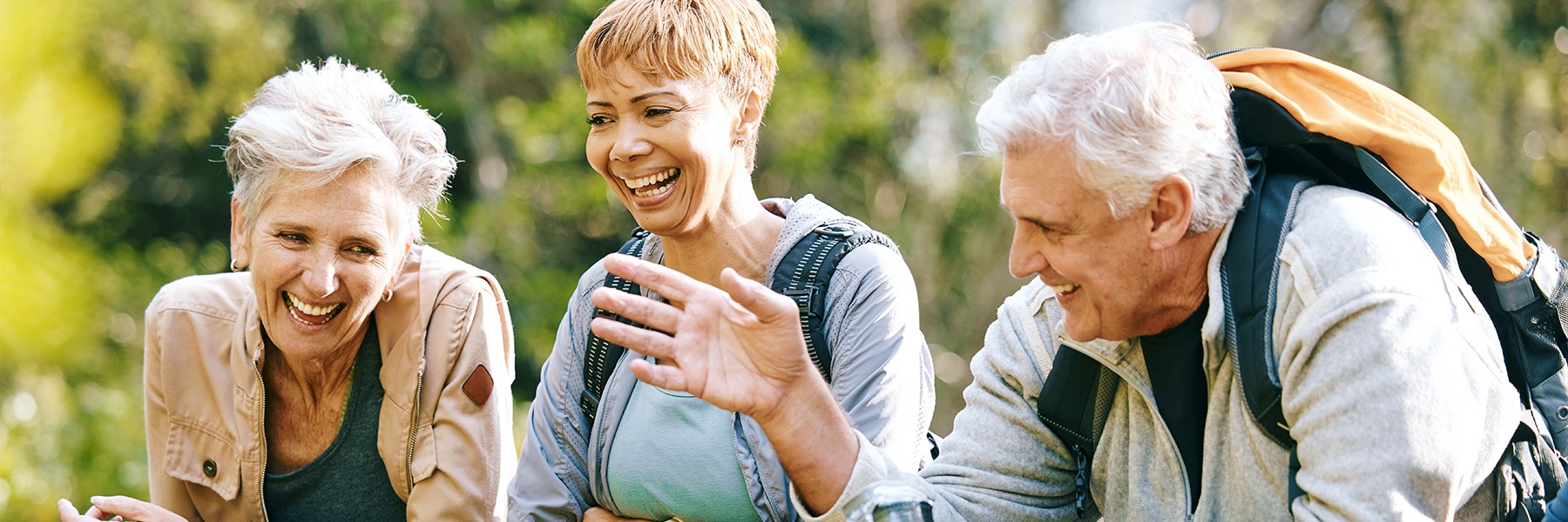 a group of people hiking and laughing together